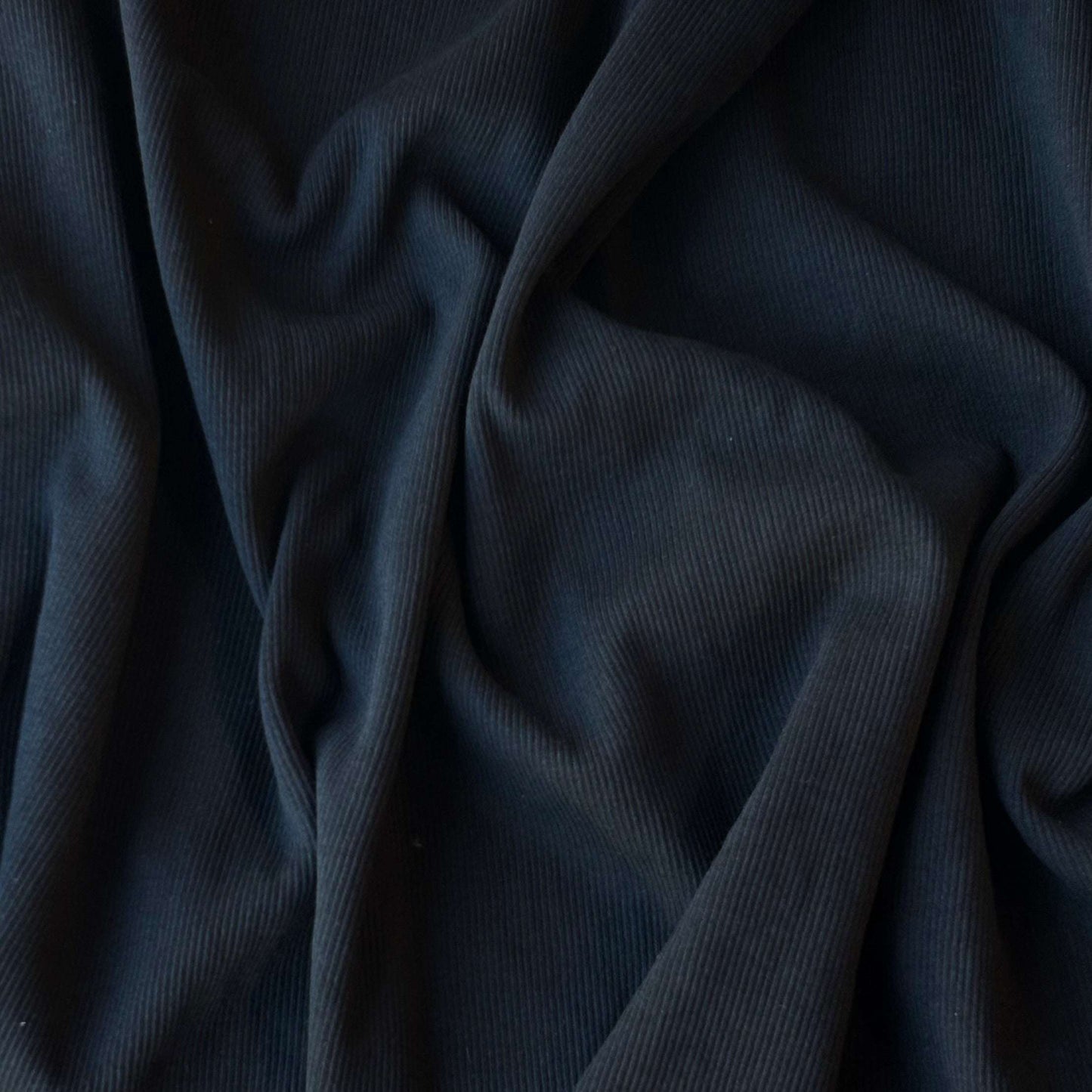 Cotton Rib presenting the Black version of a heavyweight fine pure cotton fabric