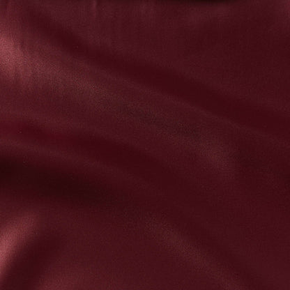 countess presenting the burgundy color version of a crisp satin pure polyester fabric with moderate drape