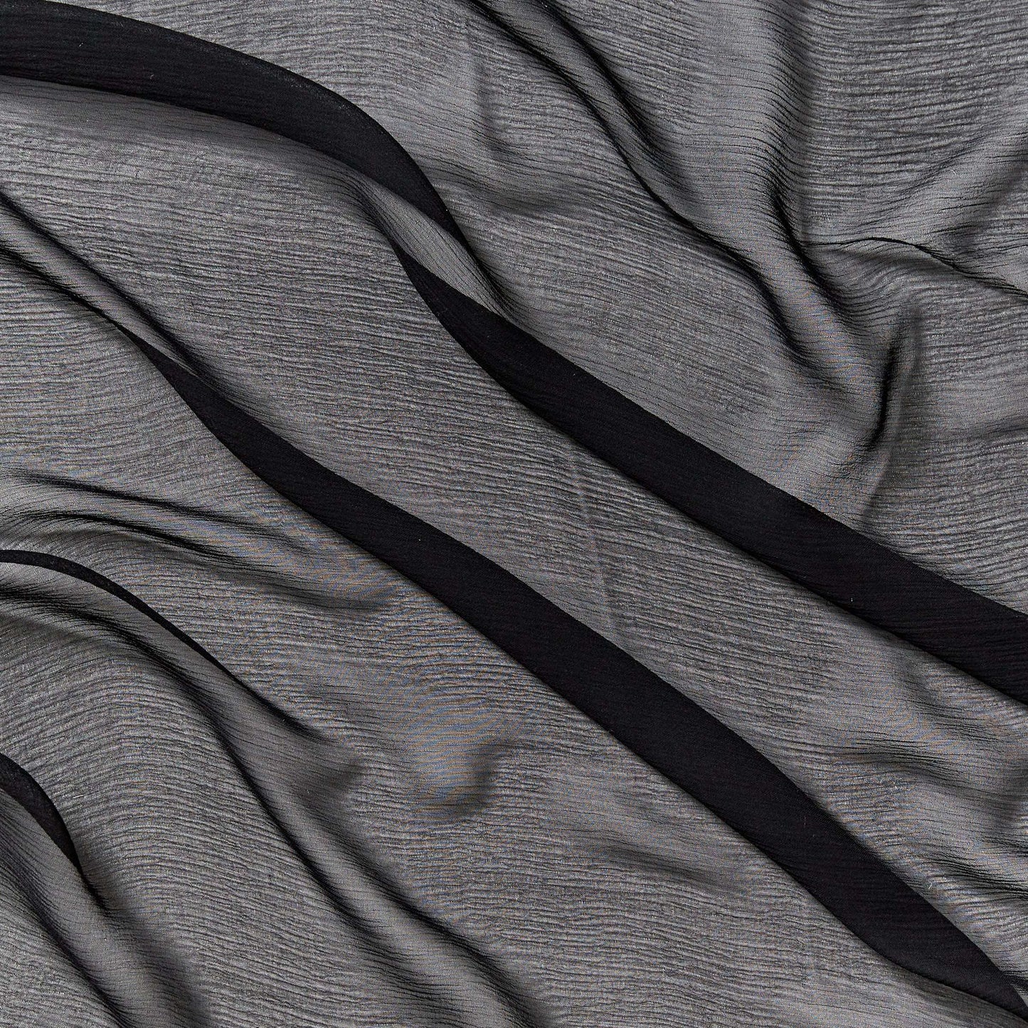 silk crinkle chiffon showing the black color version of a sheer soft pure silk with textured yoryu weave and fluid drape