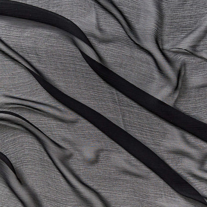 silk crinkle chiffon showing the black color version of a sheer soft pure silk with textured yoryu weave and fluid drape