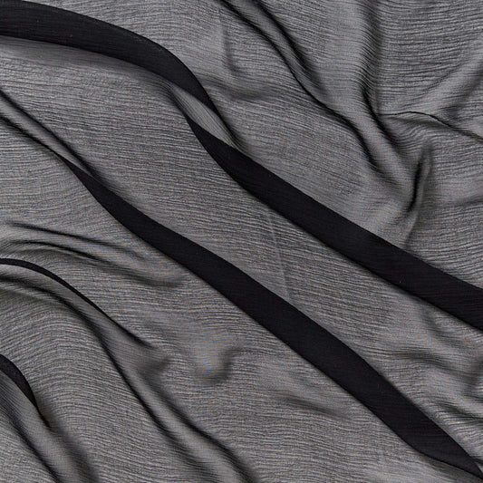 silk crinkle chiffon showing the black color version of a sheer soft pure silk with textured yoryu weave and fluid drape