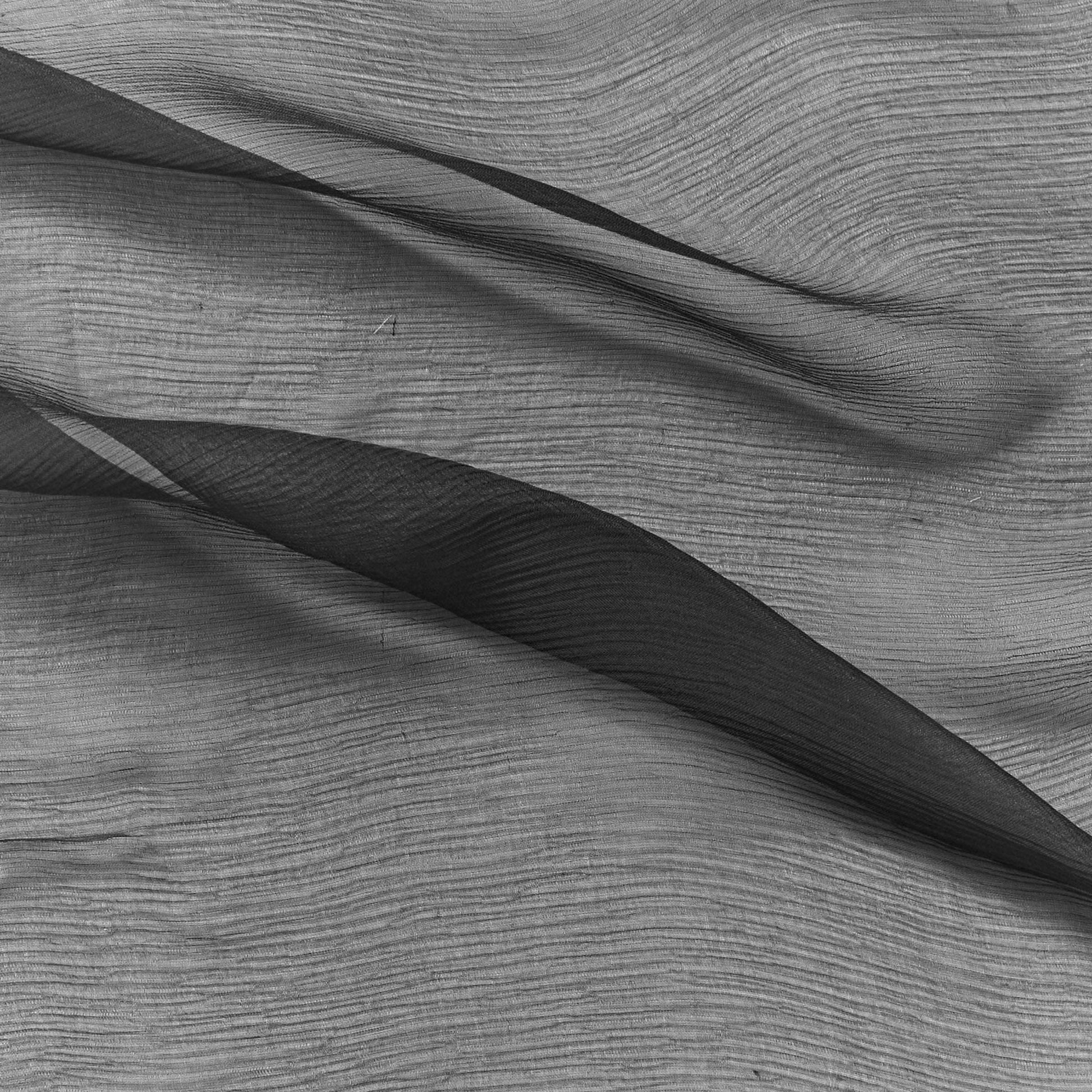 silk crinkle chiffon showing the charcoal color version of a sheer soft pure silk with textured yoryu weave and fluid drape