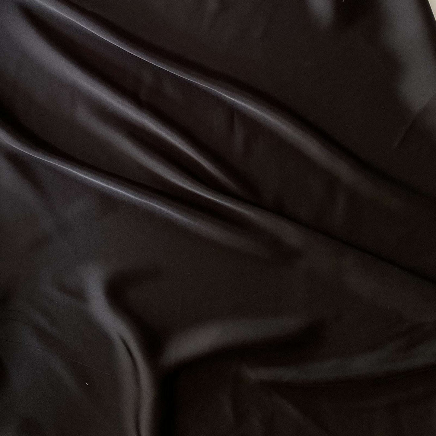 Deluxe presenting the black color version of a satin chiffon silk like pure polyester with fluid drape