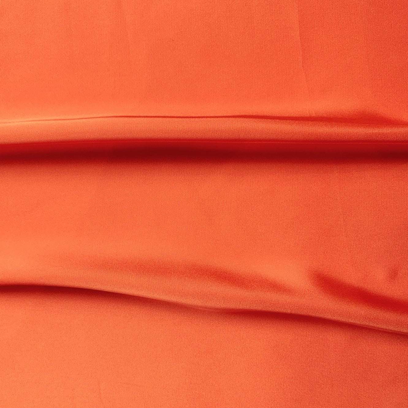 Deluxe presenting the coral color version of a satin chiffon silk like pure polyester with fluid drape