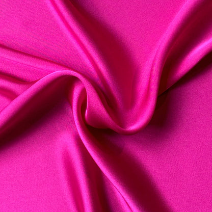 Deluxe displaying the fuchsia color version of a satin colored chiffon silk like pure polyester with fluid drape