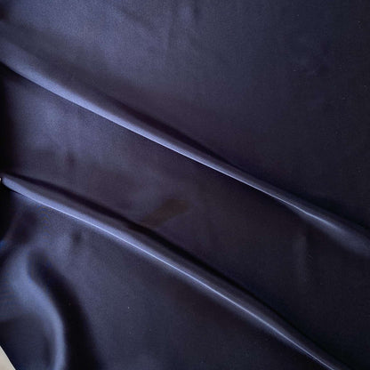 Deluxe presenting the navy color version of a satin chiffon silk like pure polyester with fluid drape