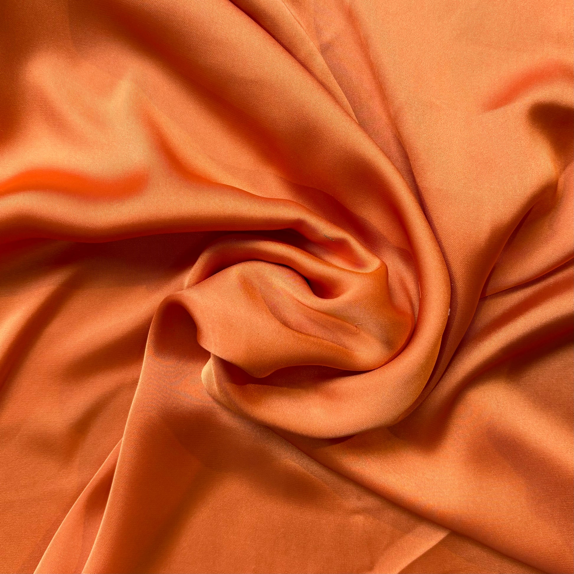 Deluxe displaying the ochre color version of a satin colored chiffon silk like pure polyester with fluid drape