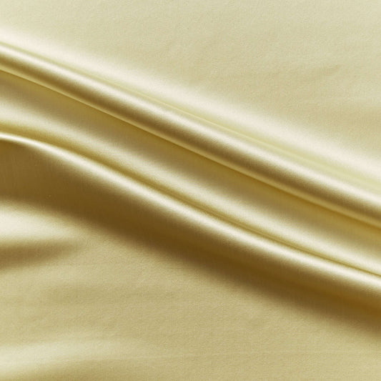 Duchess showing the light gold color version on heavy weight mulberry silk satin with moderate drape