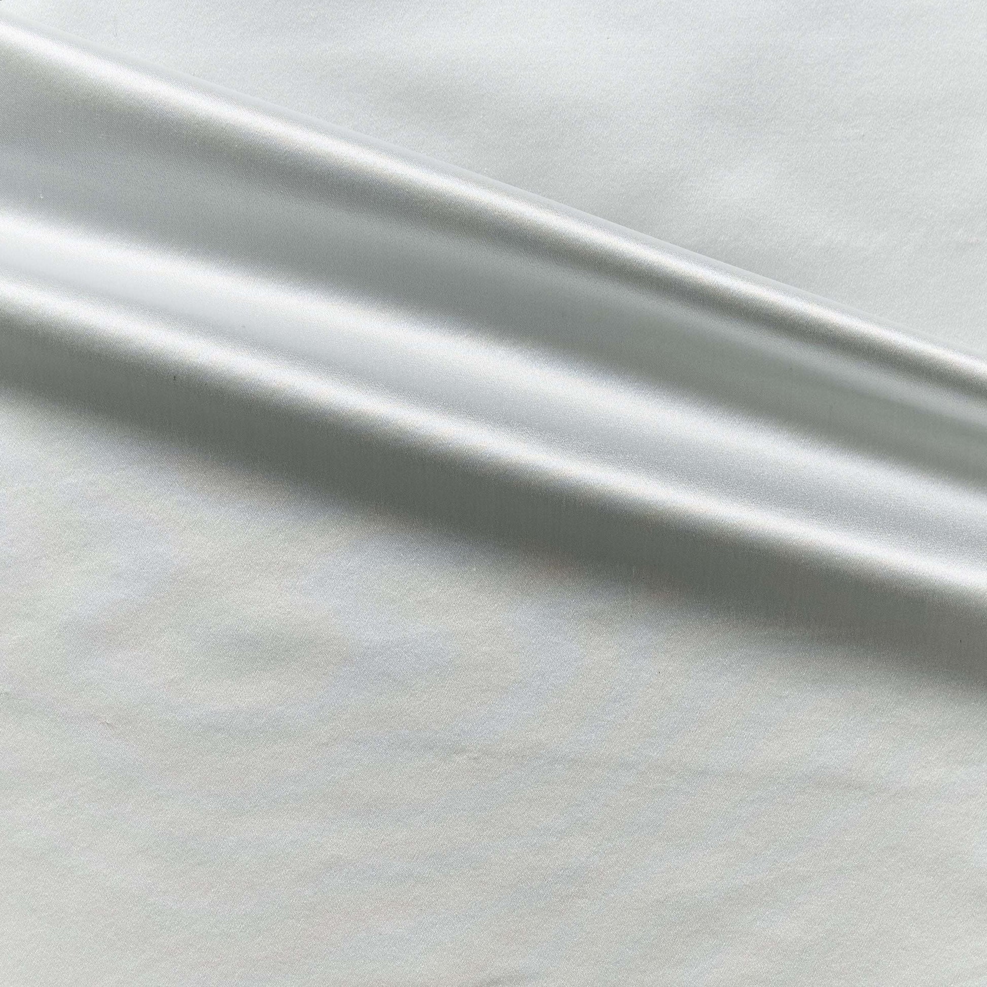 Duchess showing the pale blue color version on heavy weight mulberry silk satin with moderate drape