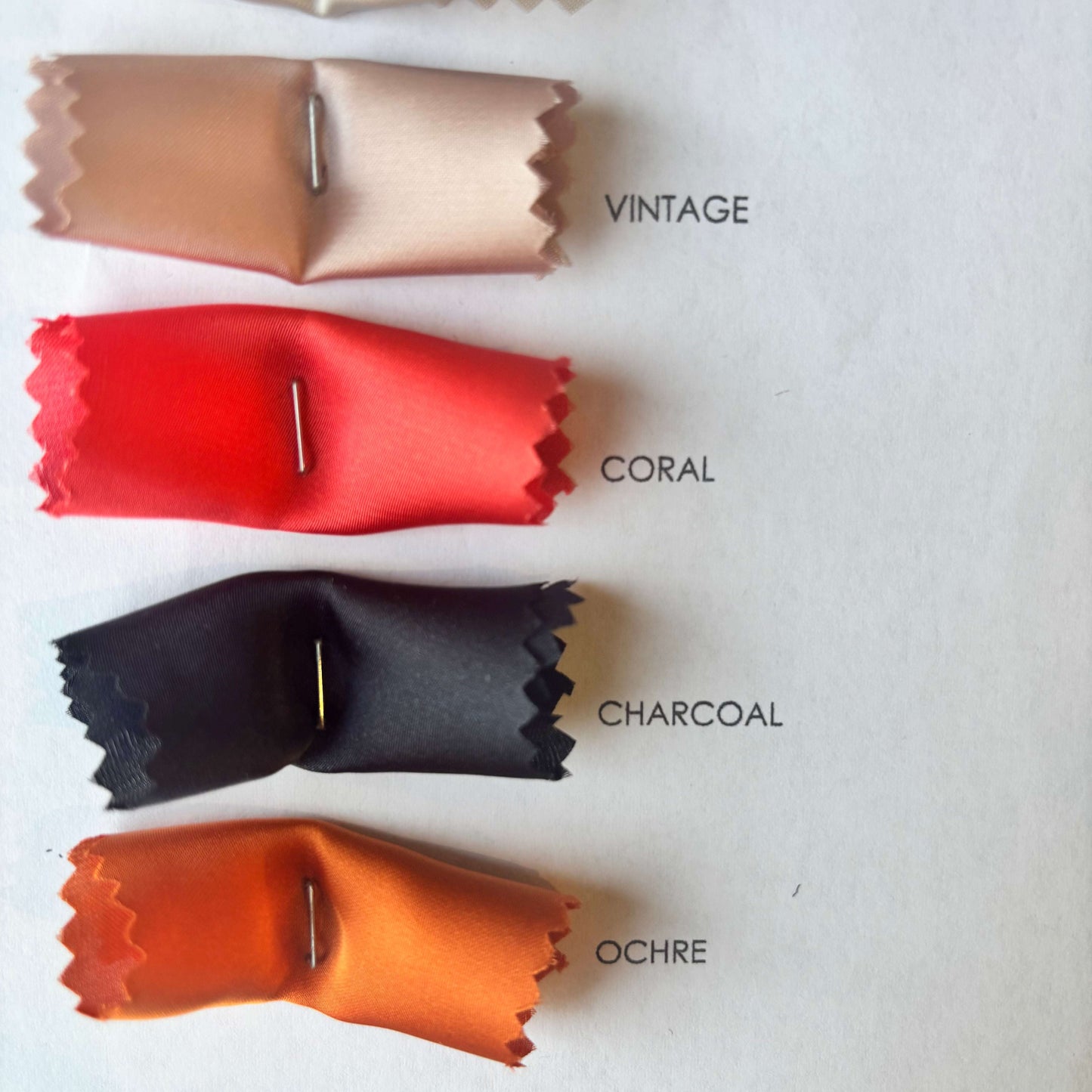 Presenting the Deluxe color swatches of vintage, coral, charcoal and ochre