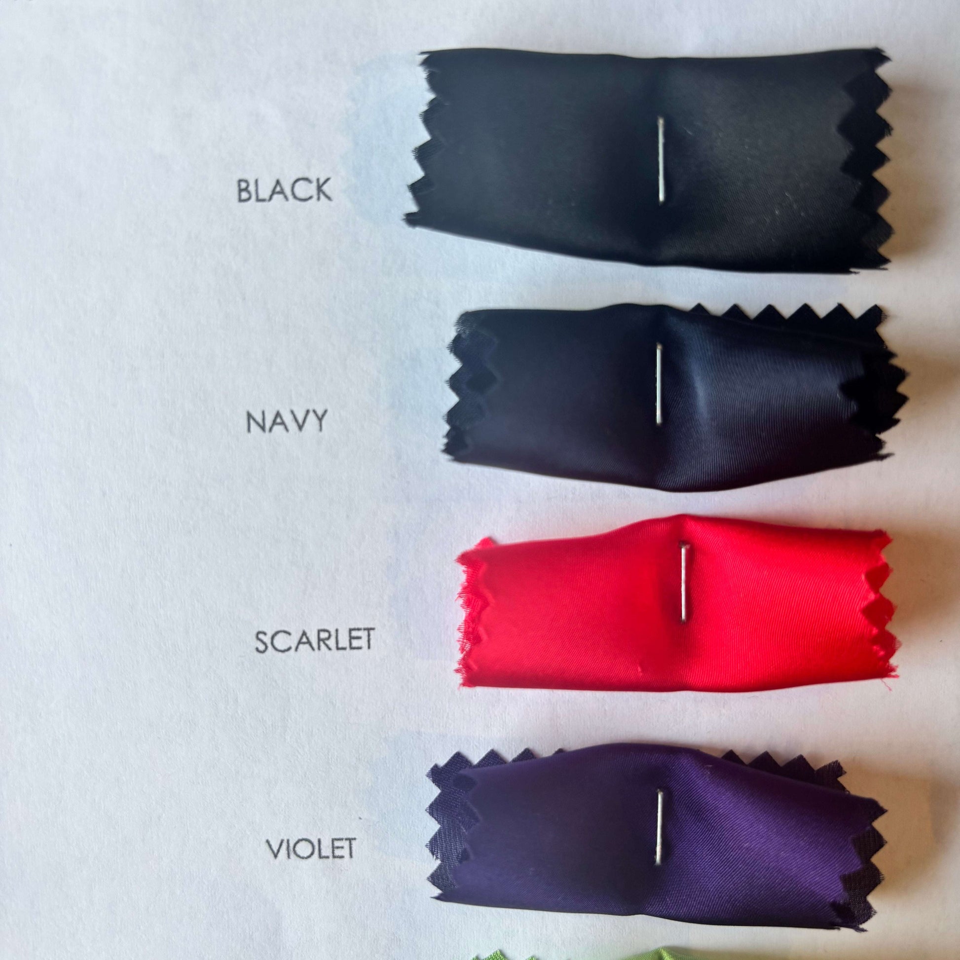Presenting the Deluxe color swatches of black navy scarlet and violet