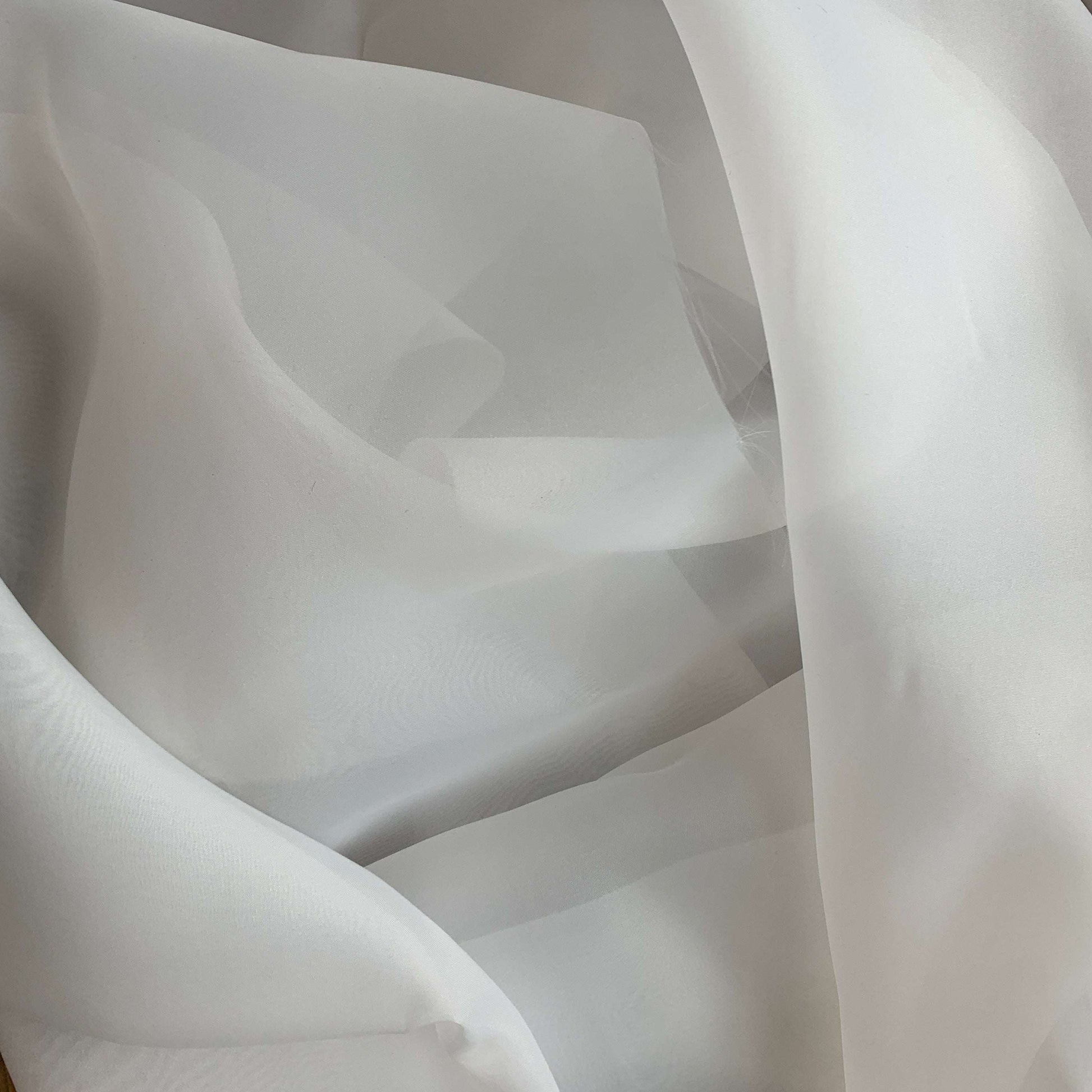 Presenting Gazar Satin Organza a ivory colored lustrous poly organza with a soft hand-feel