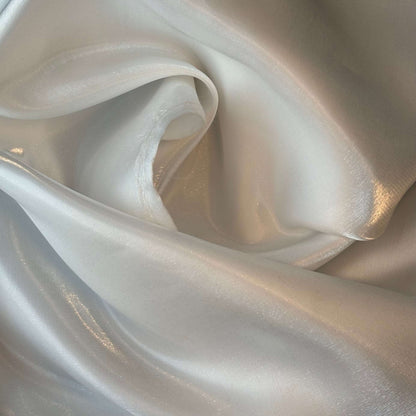 Presenting Glace a pure polyester bridal or evening wear fabric with a mirror finish in a ivory colour
