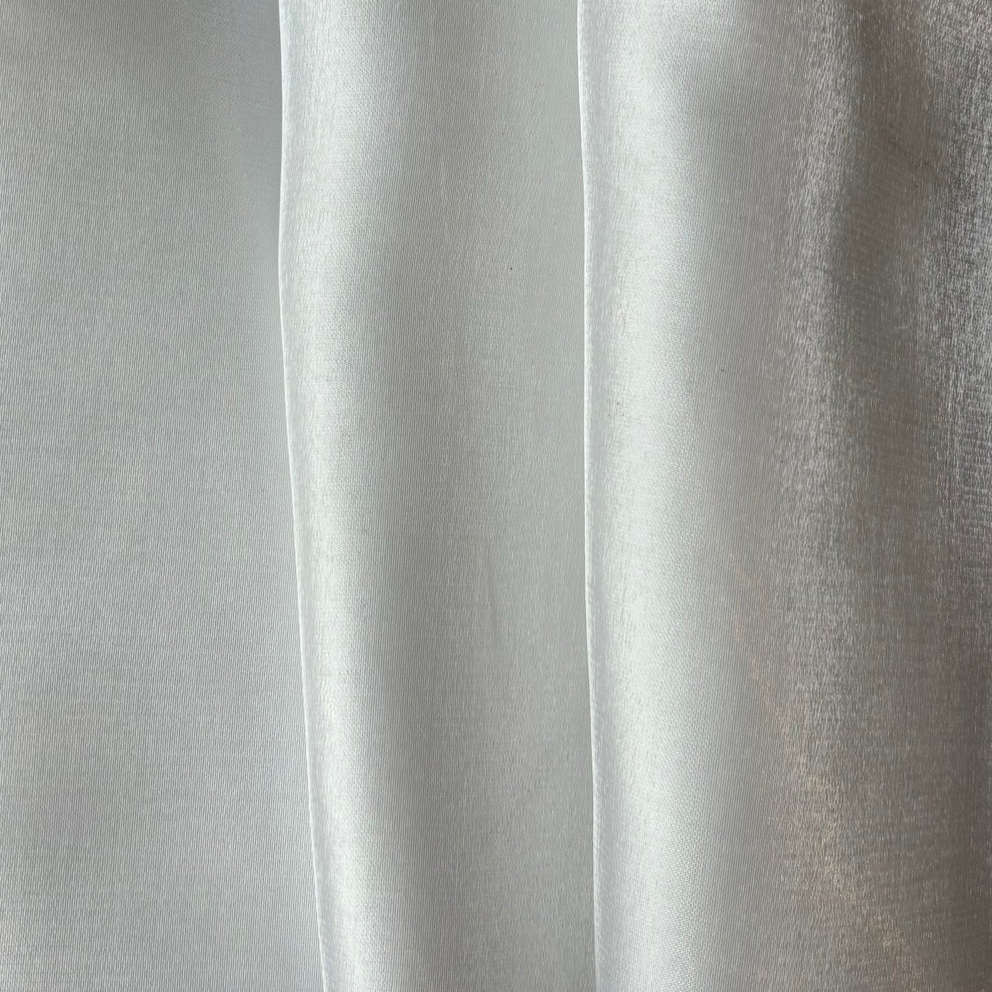 Displaying Glace a pure polyester bridal or evening wear fabric with a mirror finish in a ivory colour