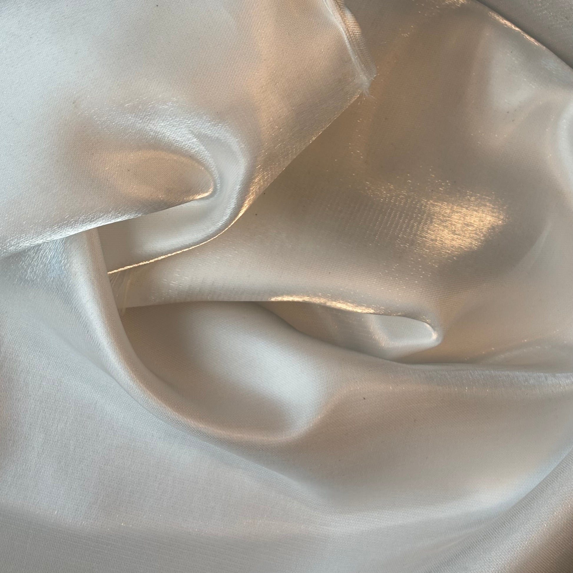 Displaying Glace a pure polyester bridal or evening wear fabric with a mirror finish