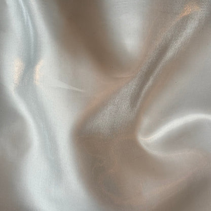 Displaying Glace a pure polyester bridal or evening wear fabric with a mirror finish in a ivory colour