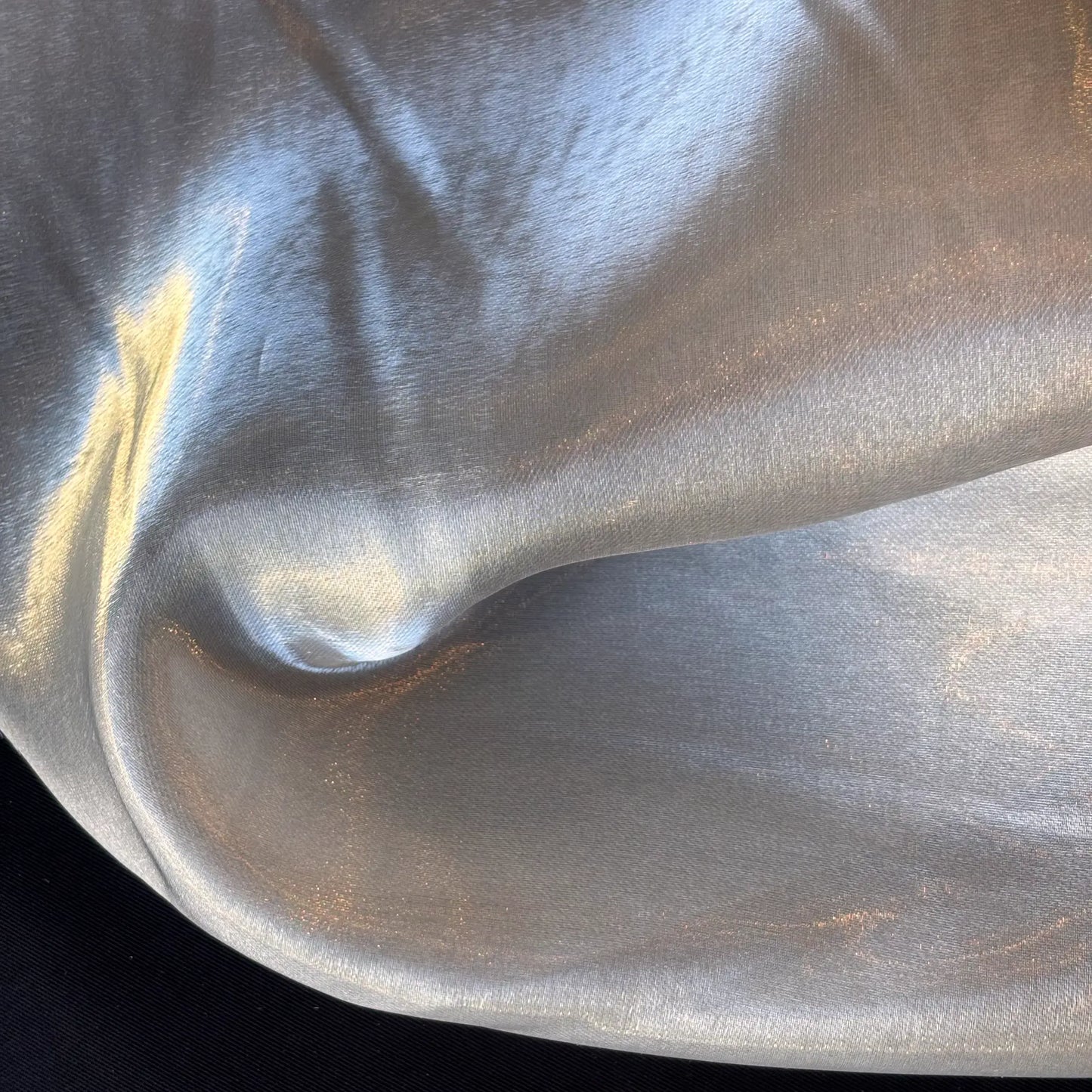 Showing Glacier a pure polyester liquid satin in an ivory shade