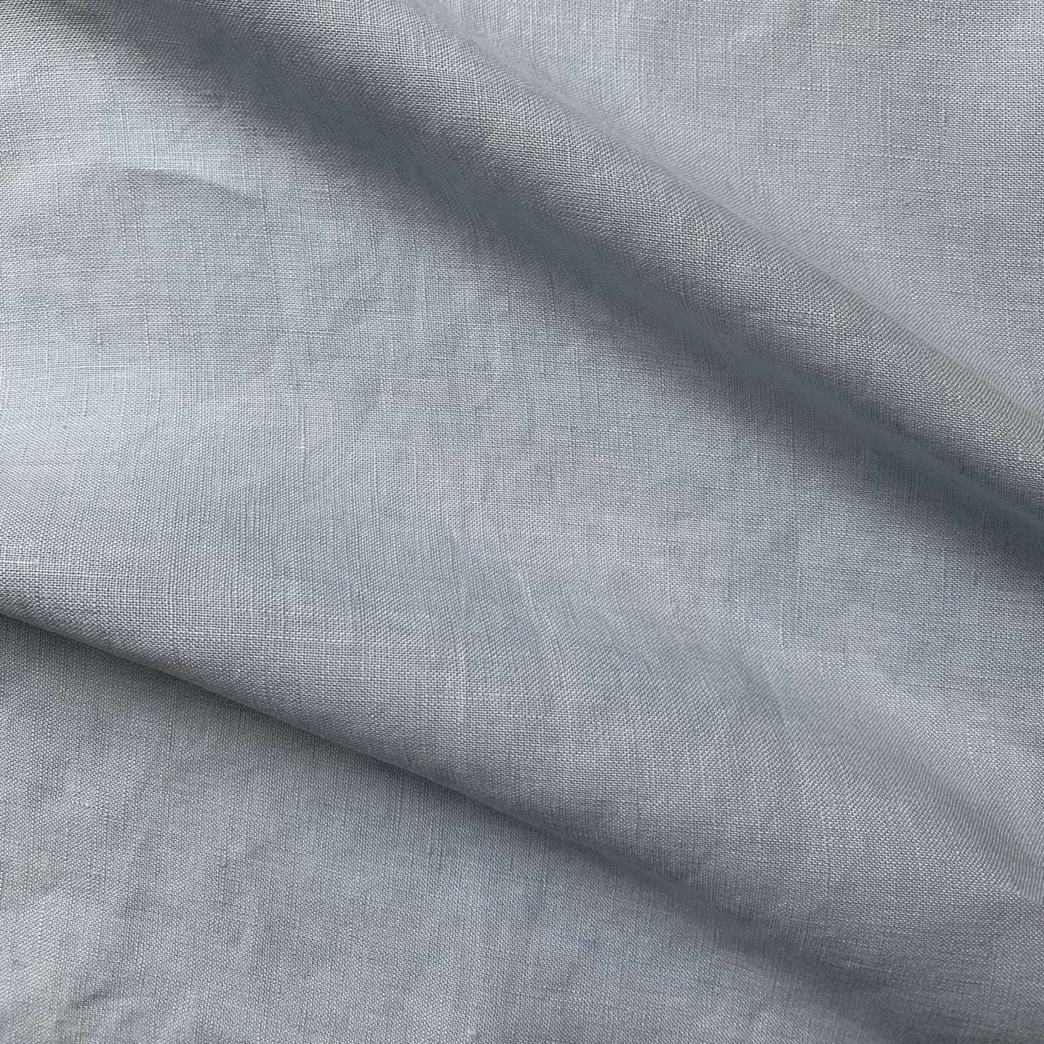 HANKY LINEN presenting the chambray blue color version of the dress weight breathable soft 100% linen fabric