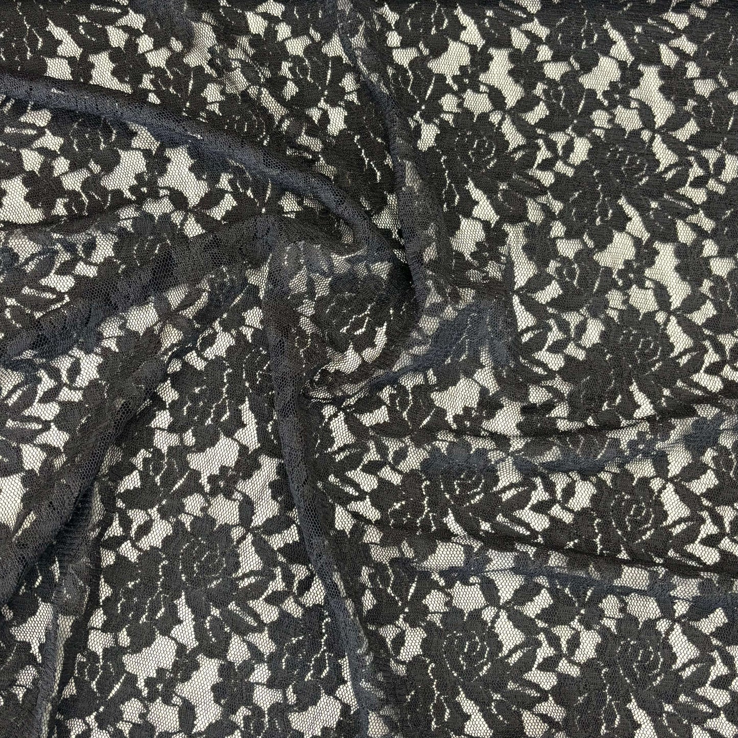 Presenting Dash Stretch Lace black cclored spandex and polyester blended floral body weight stretchable  lace fabric