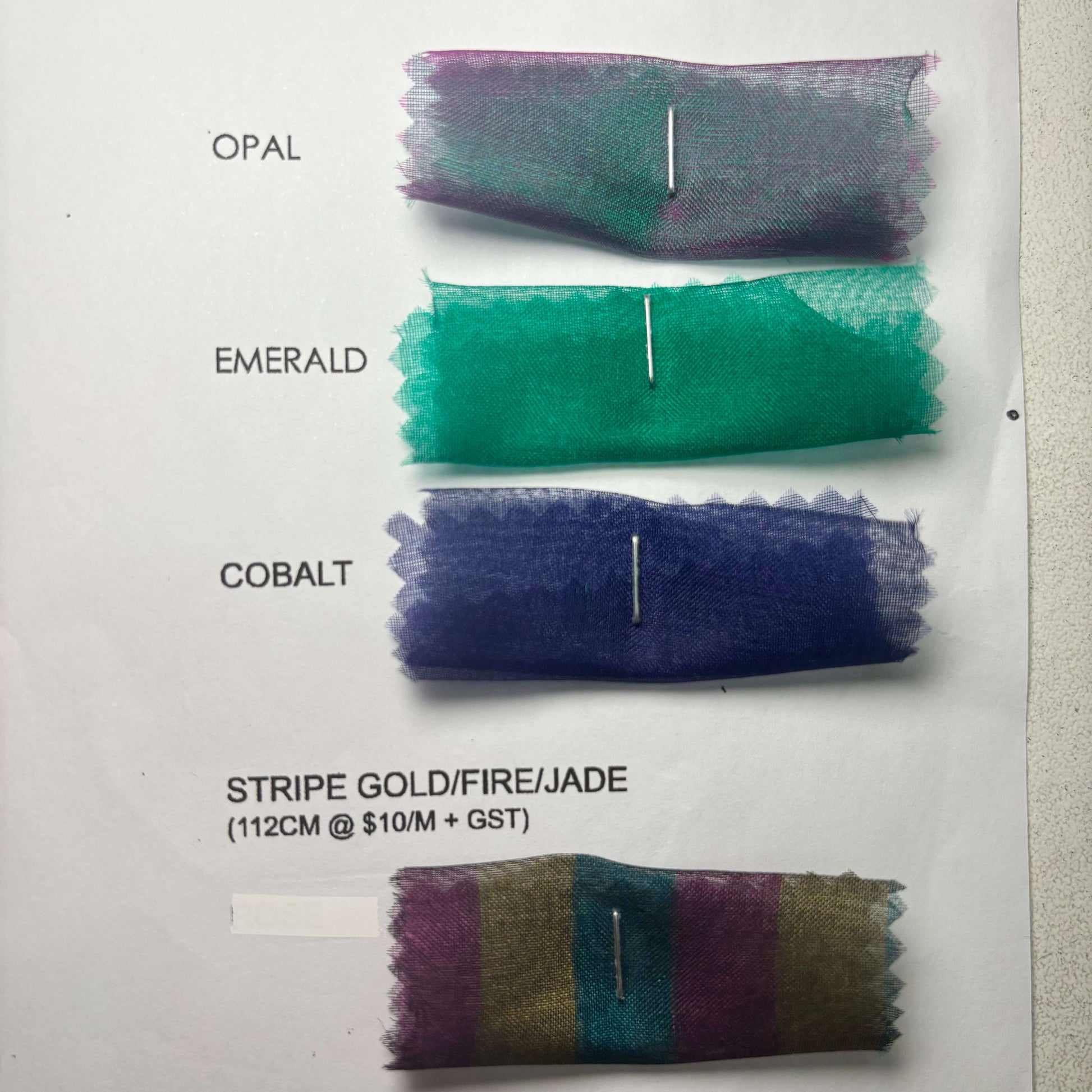 Showing the opal, emerald, cobalt and stripe gold fire jade swatches from the Silk Organza Color Card