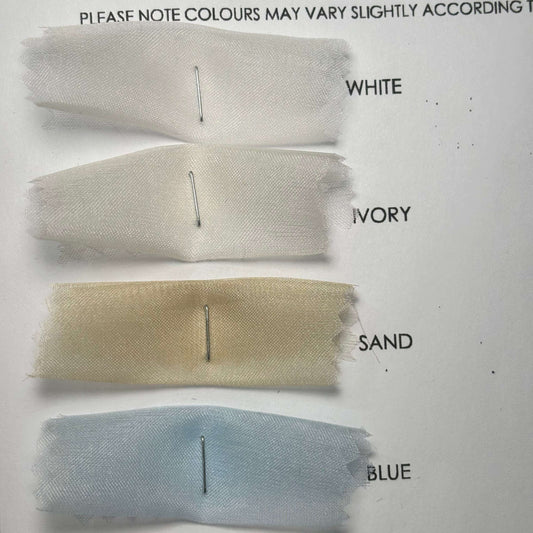 Showing a closeup of the white. ivory, sand and blue swatches from the Silk Organza Color Card