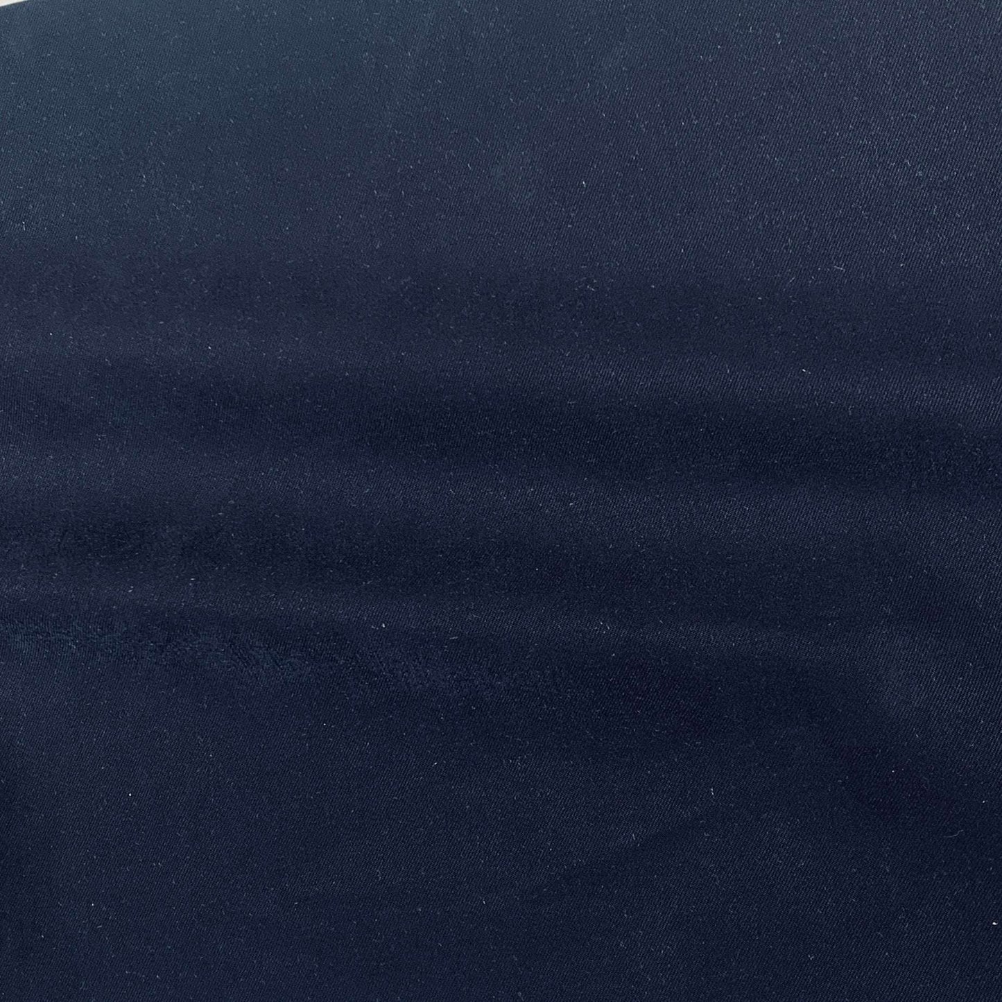 Hero presenting the black color version of a stretch model blend with lycra and poly bottom weighted