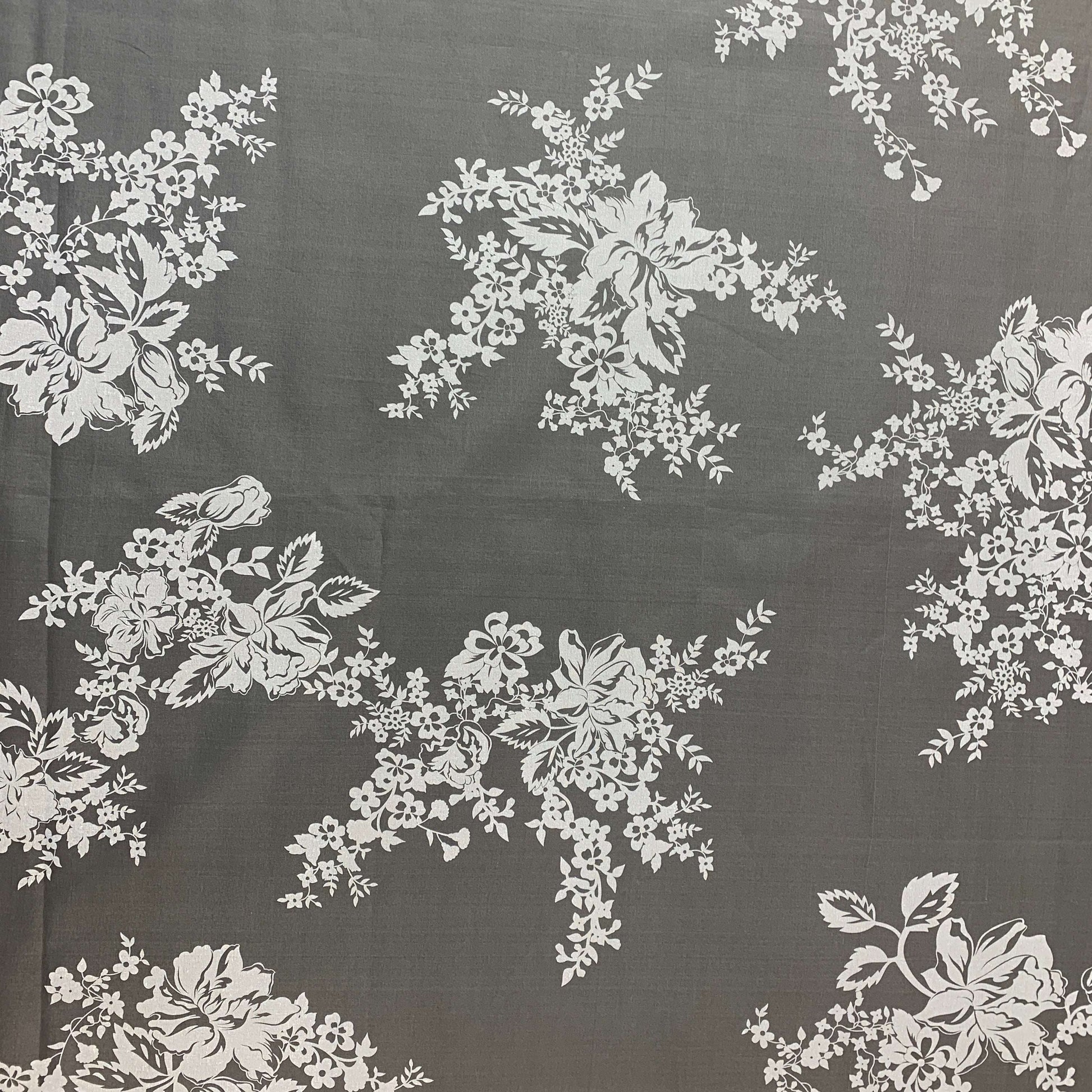 Presenting rhapsody which is a white floral print on sheer ivory pure silk organza shown flat