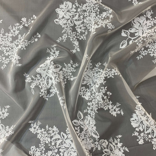 Presenting rhapsody which features a white floral print on sheer ivory pure silk organza