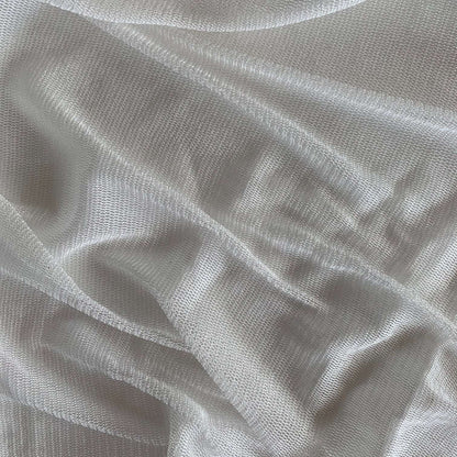 vapour showing the natural color variant of a soft sheer breathable light weight matte pure silk tulle with natural silk sheen
