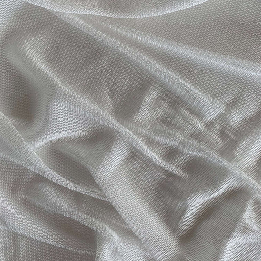 vapour showing the natural color variant of a soft sheer breathable light weight matte pure silk tulle with natural silk sheen