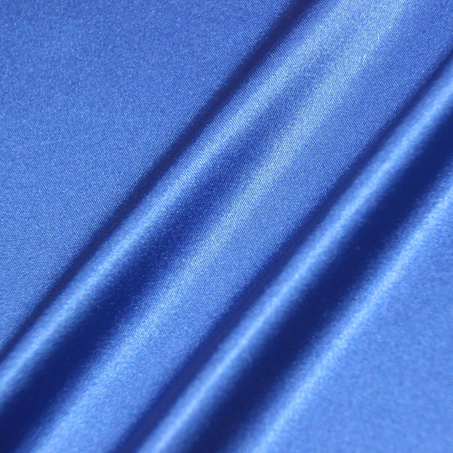 lola presenting the royal color version of a stretch light weight soft satin polyester with spandex
