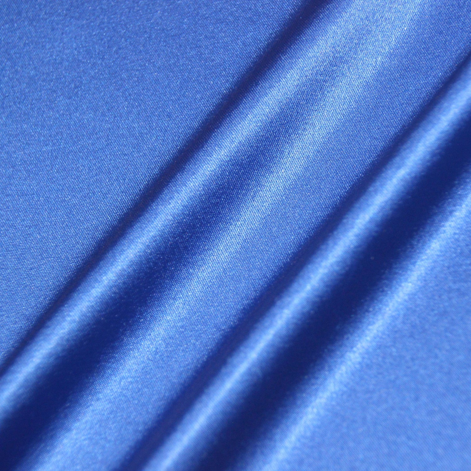 lola showing the royal color version of a stretch light weight soft satin polyester with spandex