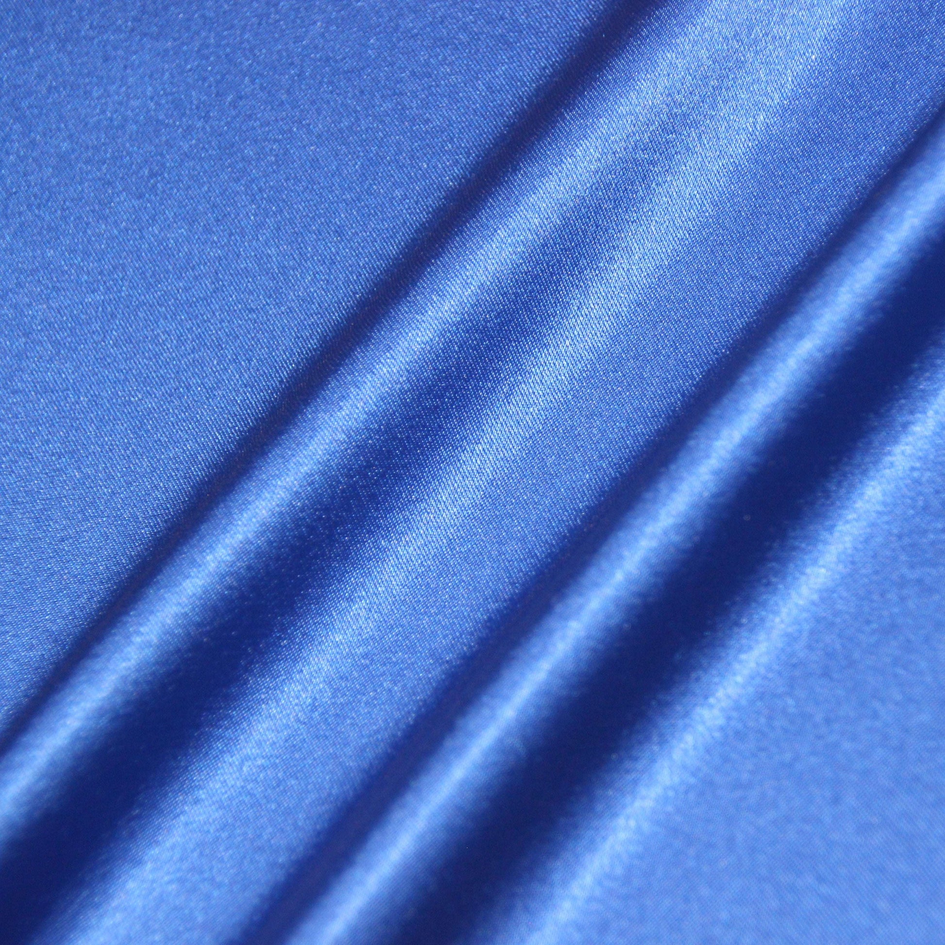 lola presenting the royal color version of a stretch light weight soft satin polyester with spandex