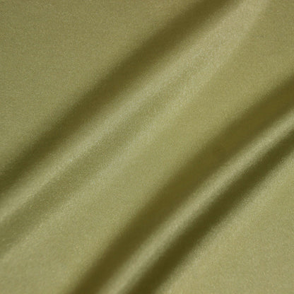 lola presenting the yellow color version of a stretch light weight soft satin polyester with spandex