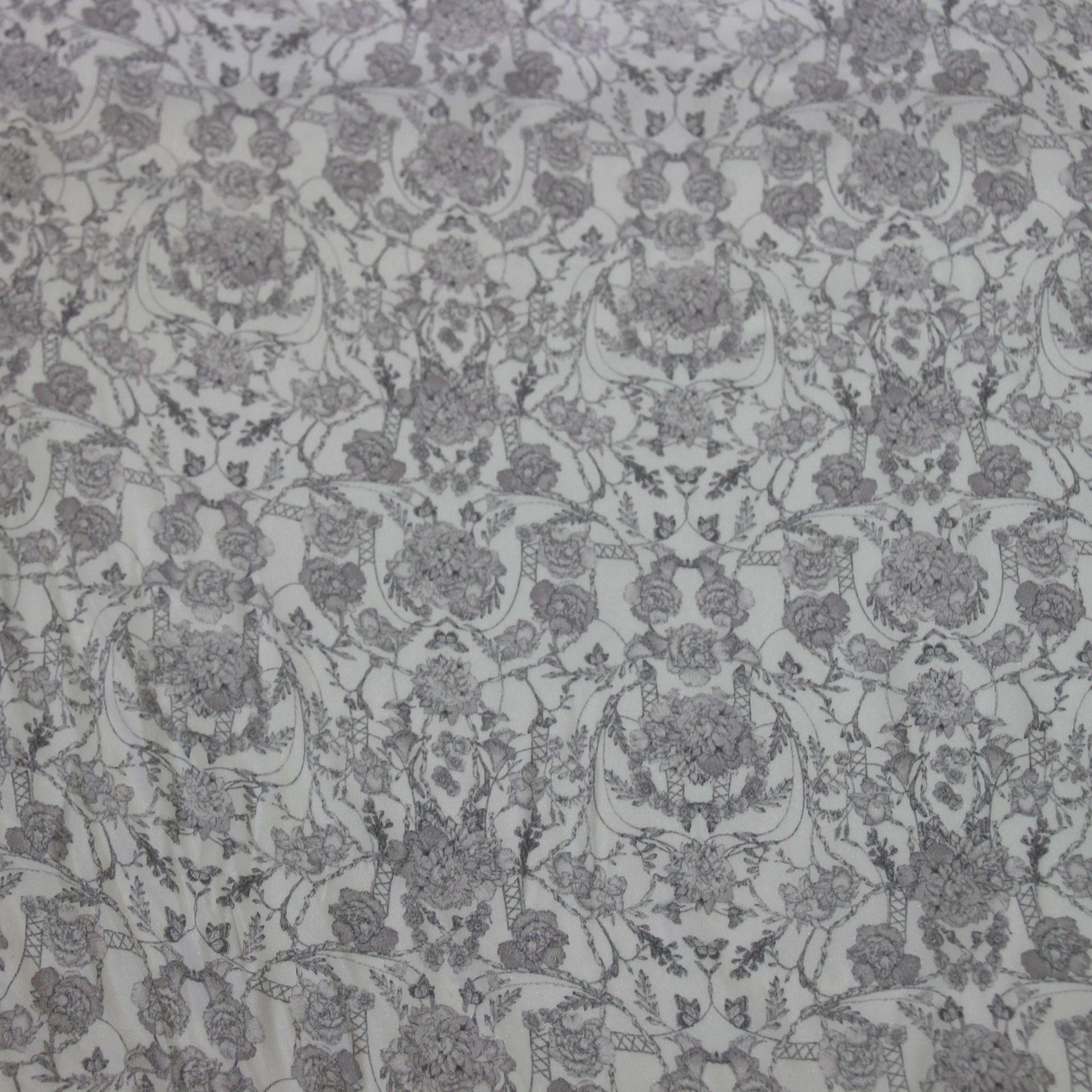 Exhibiting Filigree a gray toned floral print on pure silk
