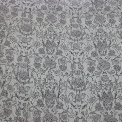 Exhibiting Filigree a gray toned floral print on pure silk