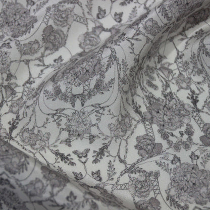Exhibiting Filigree a gray toned floral print on pure silk