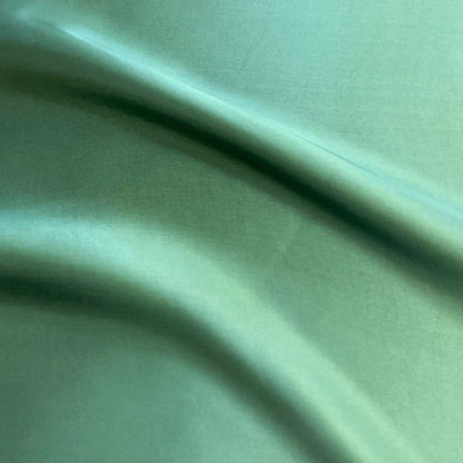saga showing the willow color version of a pure rayon Fine twill satin with fluid drape
