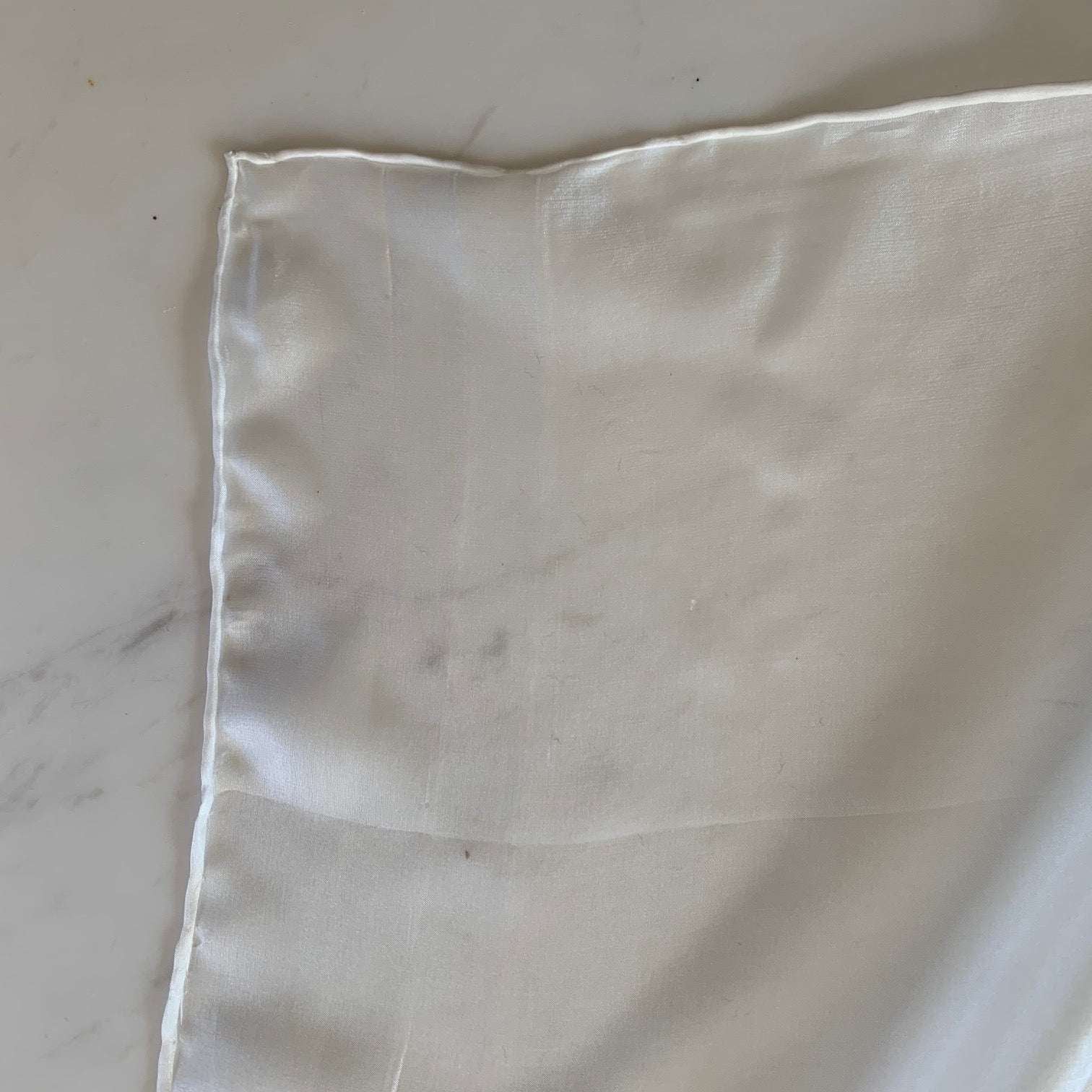 Presenting pajeant scarf a natural colored feather weight pure silk 28cm x 160cm corner with rolled edge and floaty fluid drape