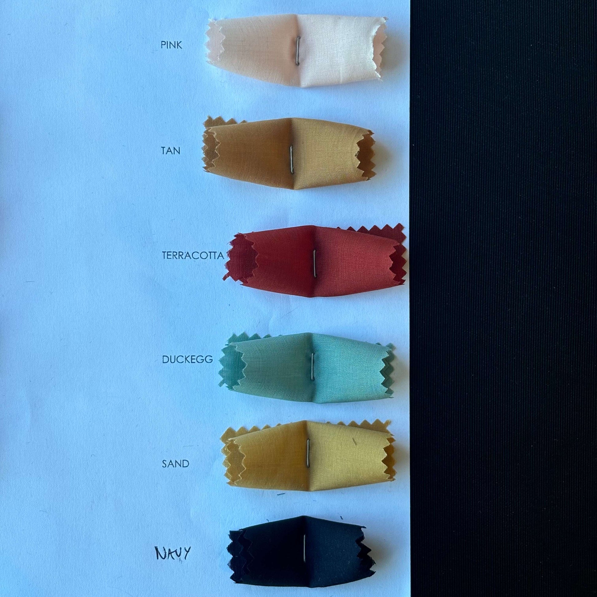 Presenting pink, tan. terracotta. ducegg. sand and navy from the Linus Color Card