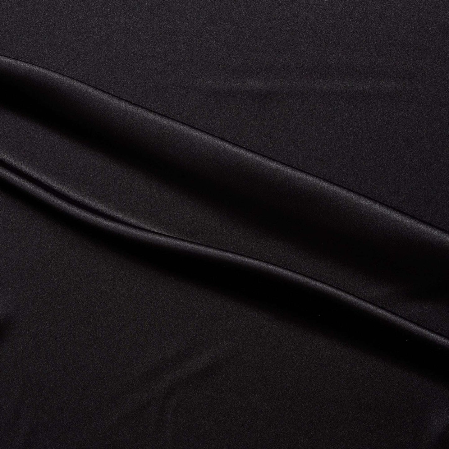lola presenting the black color version of a stretch light weight soft satin polyester with spandex