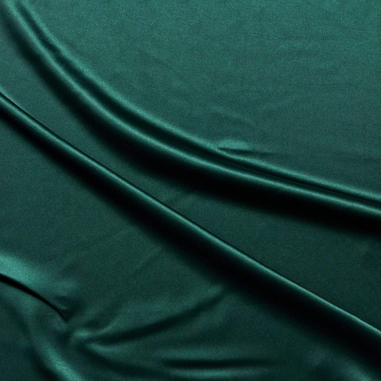 lola presenting the bottle color version of a stretch light weight soft satin polyester with spandex