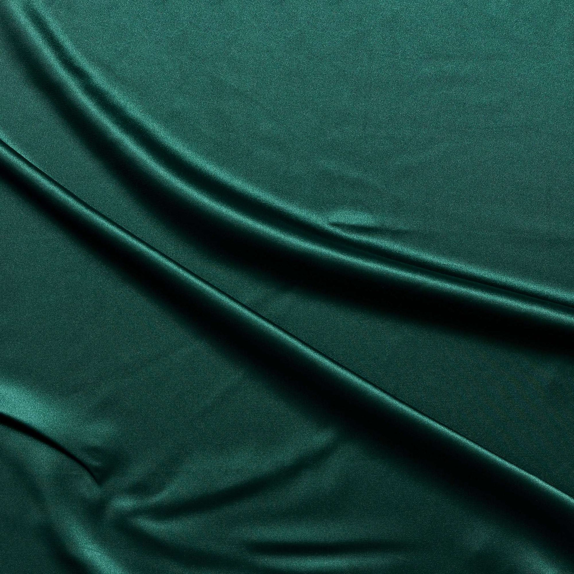 lola presenting the bottle color version of a stretch light weight soft satin polyester with spandex