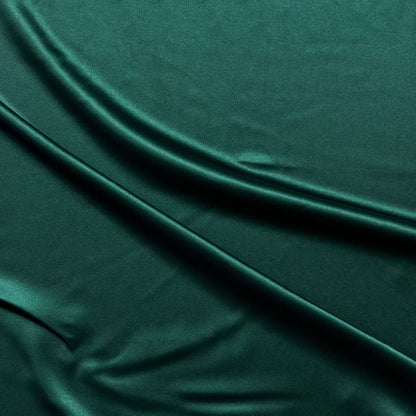 lola presenting the bottle color version of a stretch light weight soft satin polyester with spandex