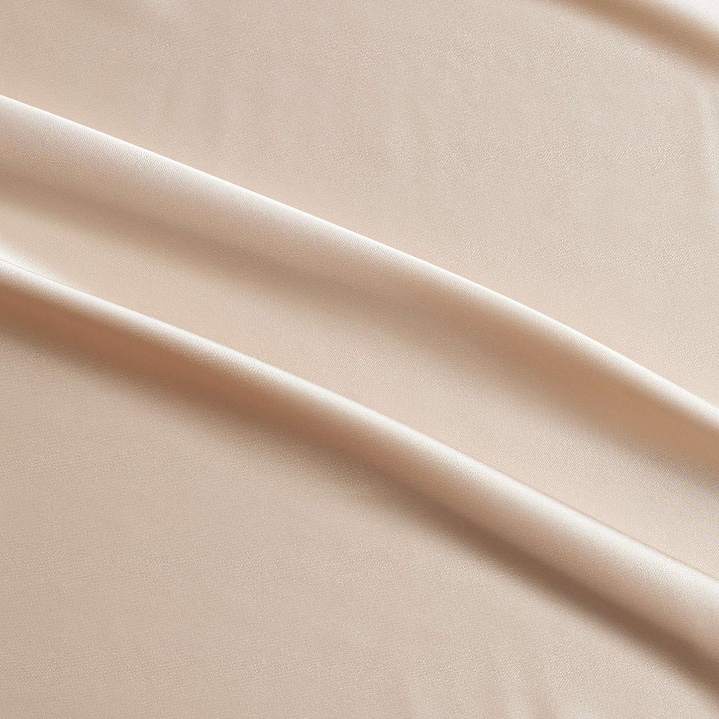 lola presenting the champagne color version of a stretch light weight soft satin polyester with spandex