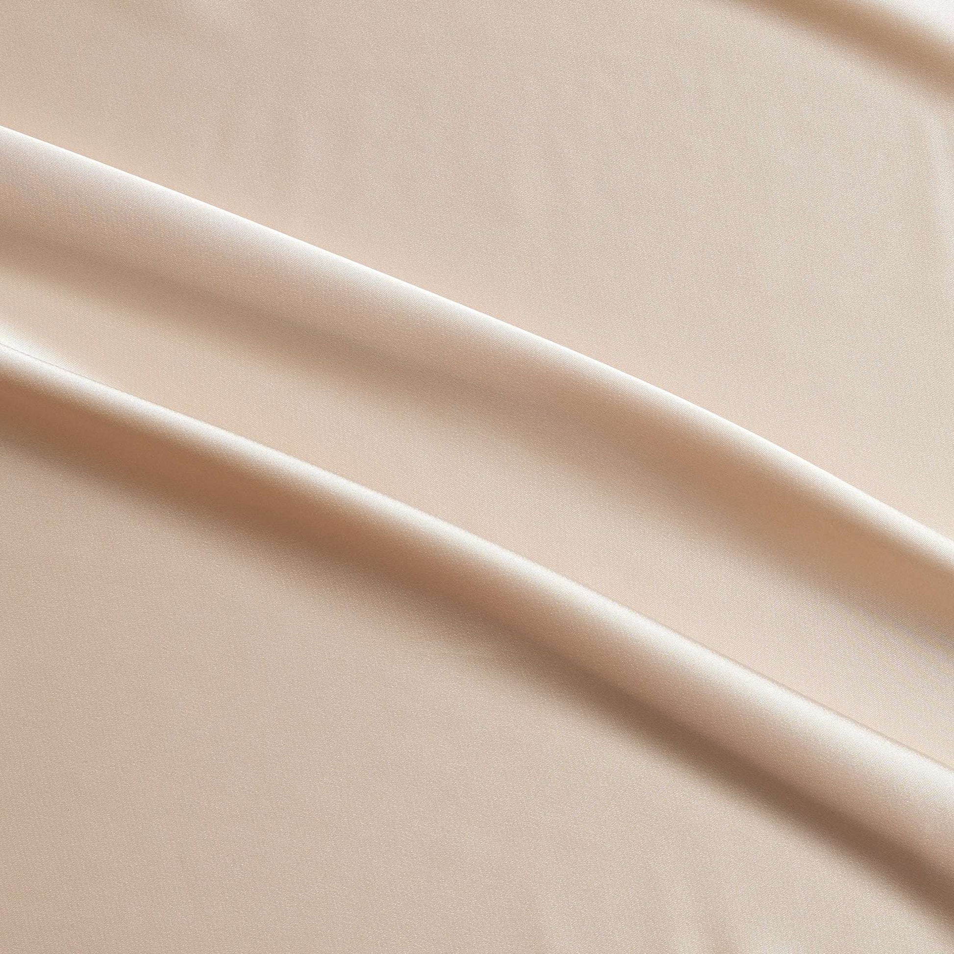 lola presenting the champagne color version of a stretch light weight soft satin polyester with spandex