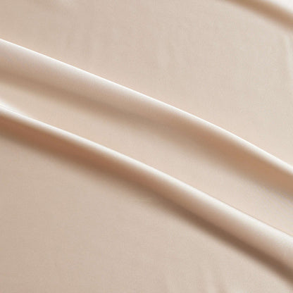 lola presenting the champagne color version of a stretch light weight soft satin polyester with spandex