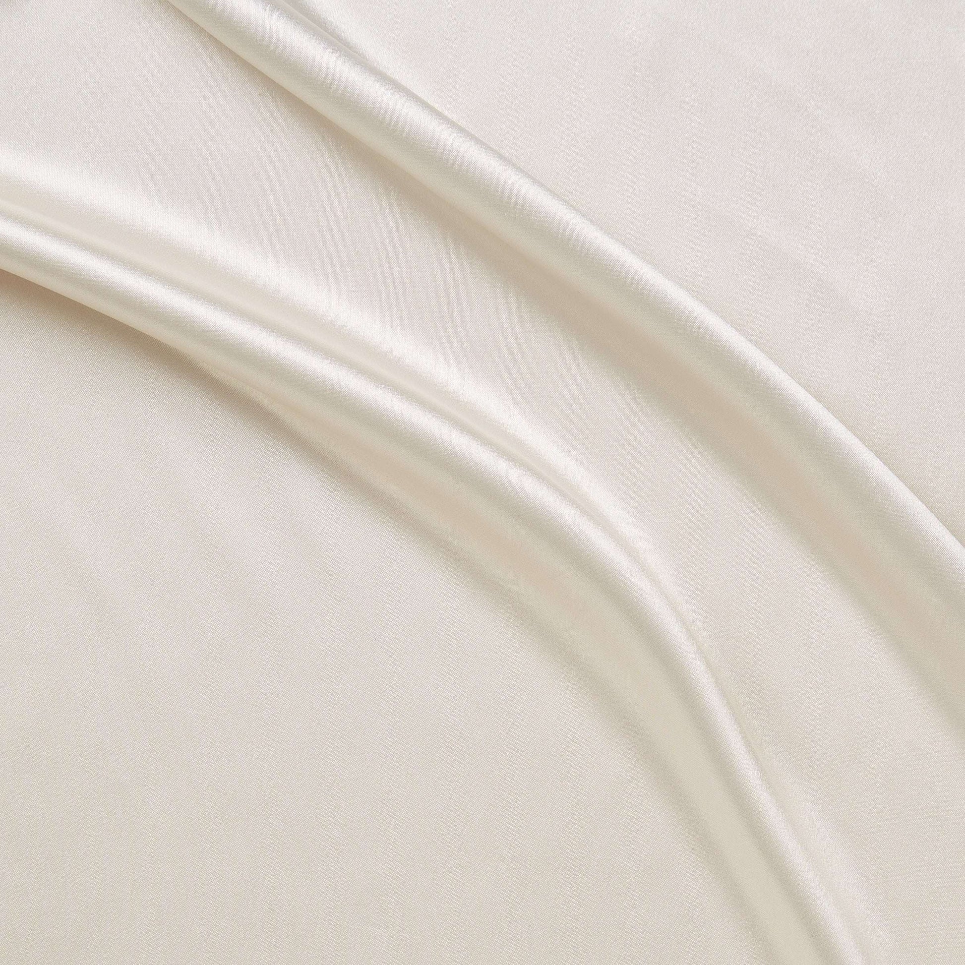 lola presenting the ivory color versions of a stretch light weight soft satin polyester with spandex