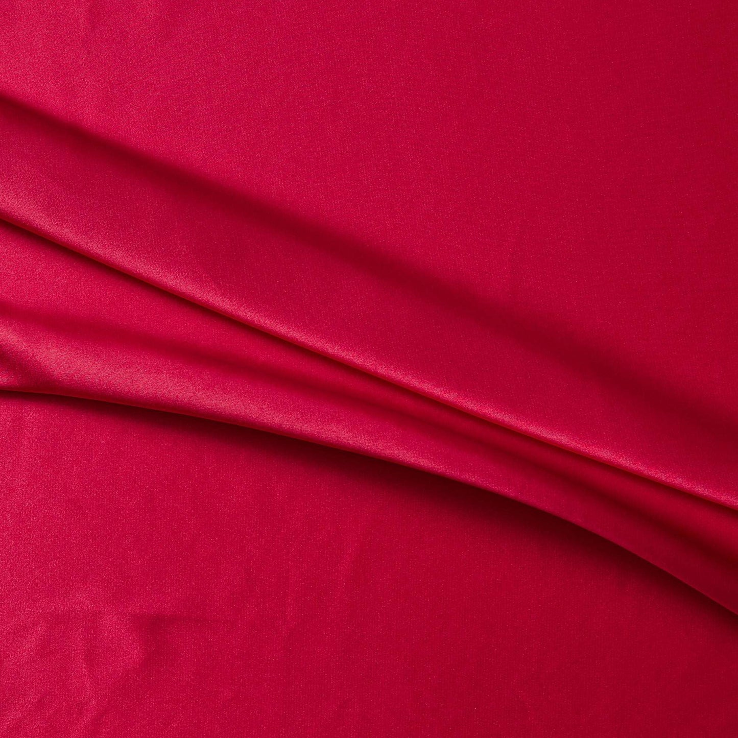 lola presenting the red color version of a stretch light weight soft satin polyester with spandex