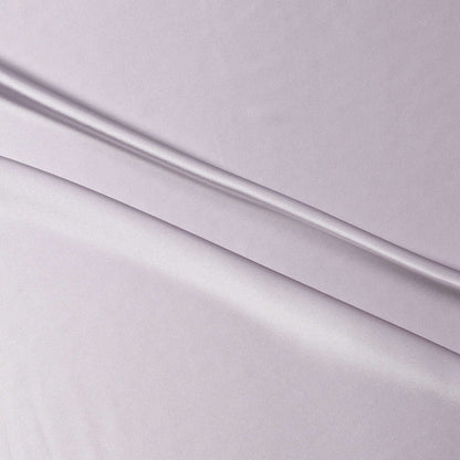 lola presenting the smoke color version of a stretch light weight soft satin polyester with spandex